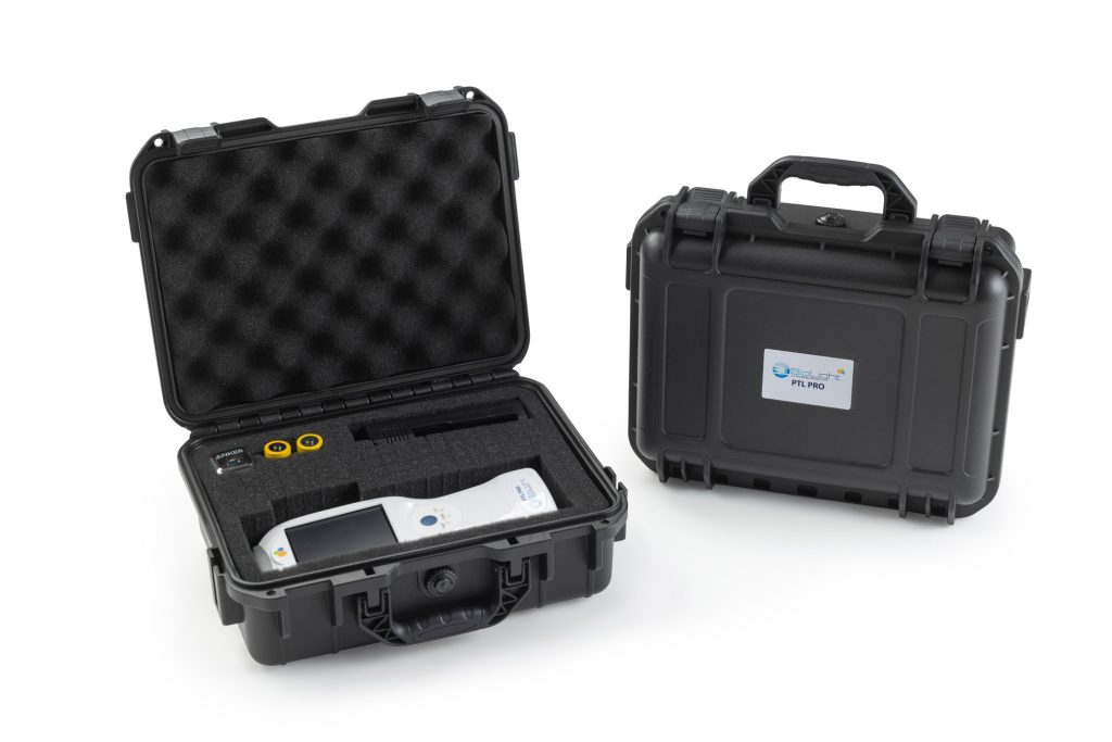 The PTL PRO handheld laser packed in its foam-lined hard carry case alongside the closed branded case
